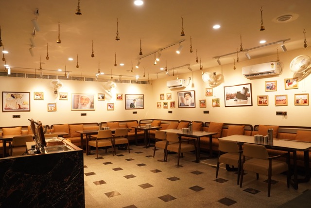 Dining hall of Shree Rajneesh Ashram decorated with photographs of Osho
